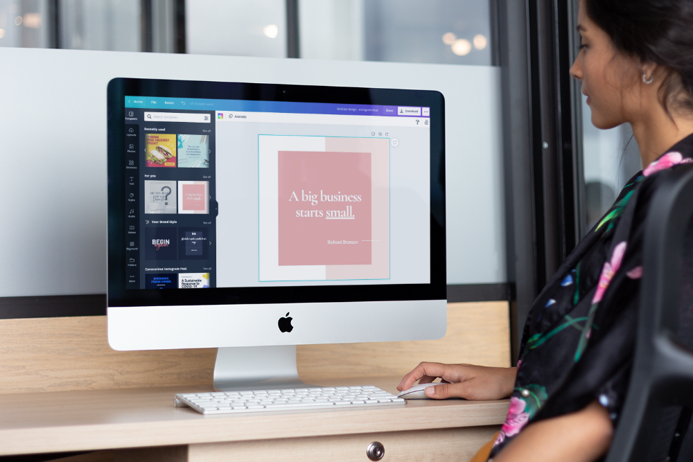 A woman creating graphics with Canva. This easy-to-use design tool is a budget-conscious marketer's best friend.